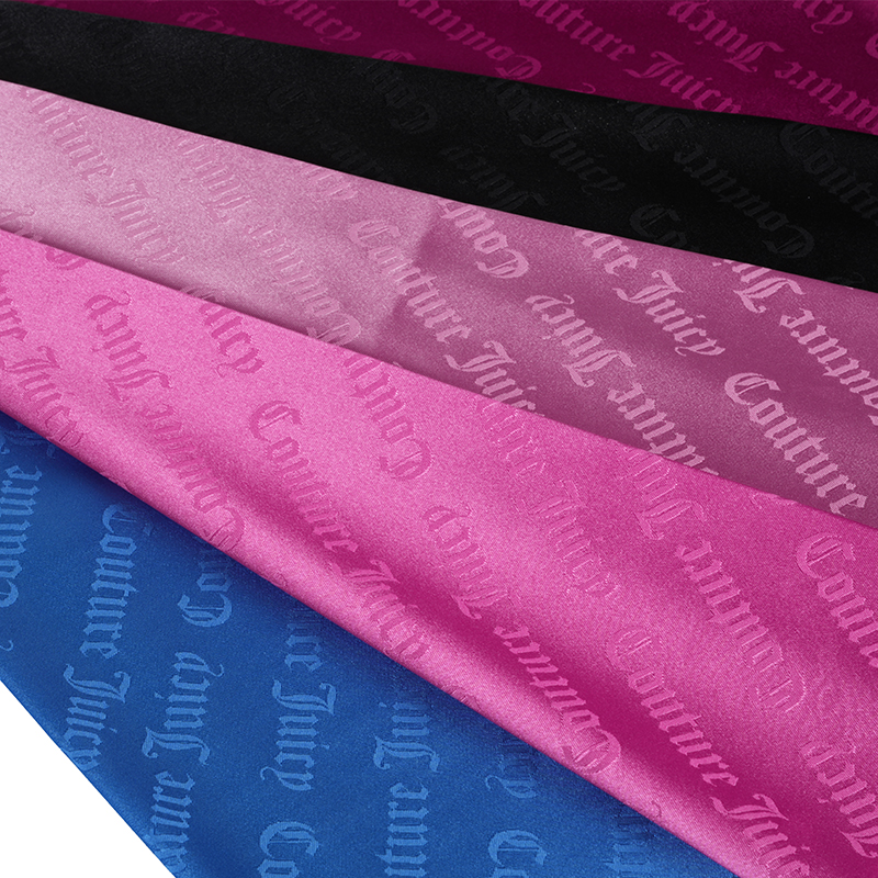 Tessuto jacquard con lettere in raso elasticizzato 75D