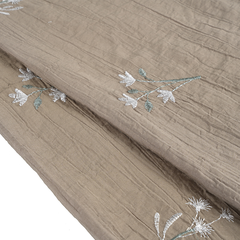 Tessuto antirughe con fiori ricamati di orchidee con semi di pesca